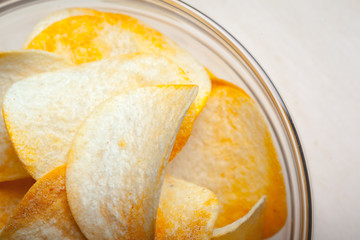 Potato chips in bowl on a table