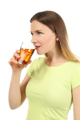 Poster - Beautiful woman drinking fresh juice on white background