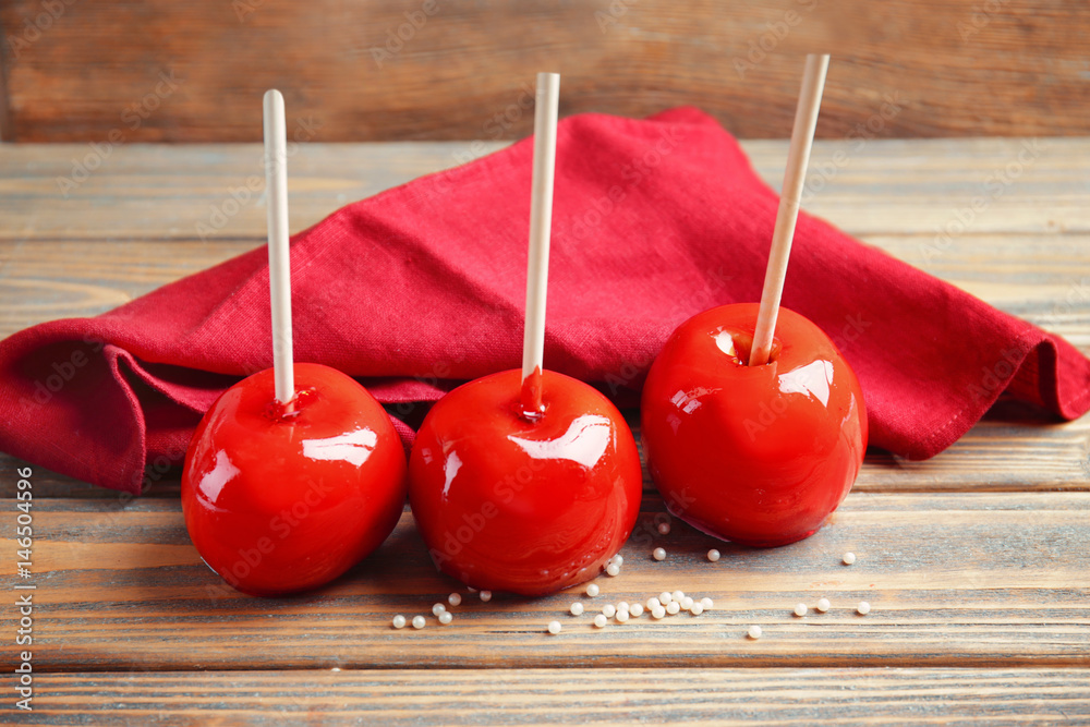 Delicious holiday apples on wooden background