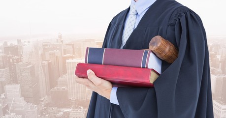 Poster - Midsection of judge with books and gavel against city