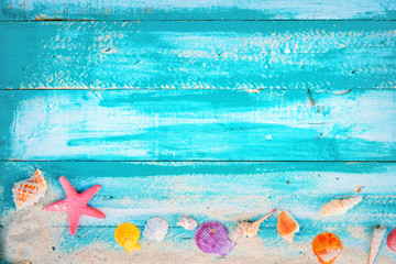 Wall Mural - Summer background - starfish, shells, coral on wood table background.  vintage color tone styles.