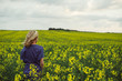© Laszlo - Woman in rapeseed field
