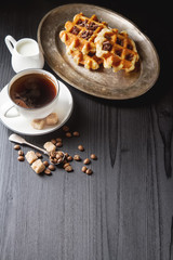 Wall Mural - Homemade belgian waffles, white ceramic cup of coffee, milk, tea