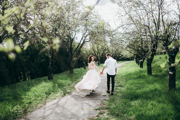 Wall Mural -  Loves and very happy groom and bride in the park