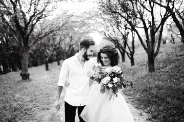 Wall Mural -  Loves and very happy groom and bride in the park