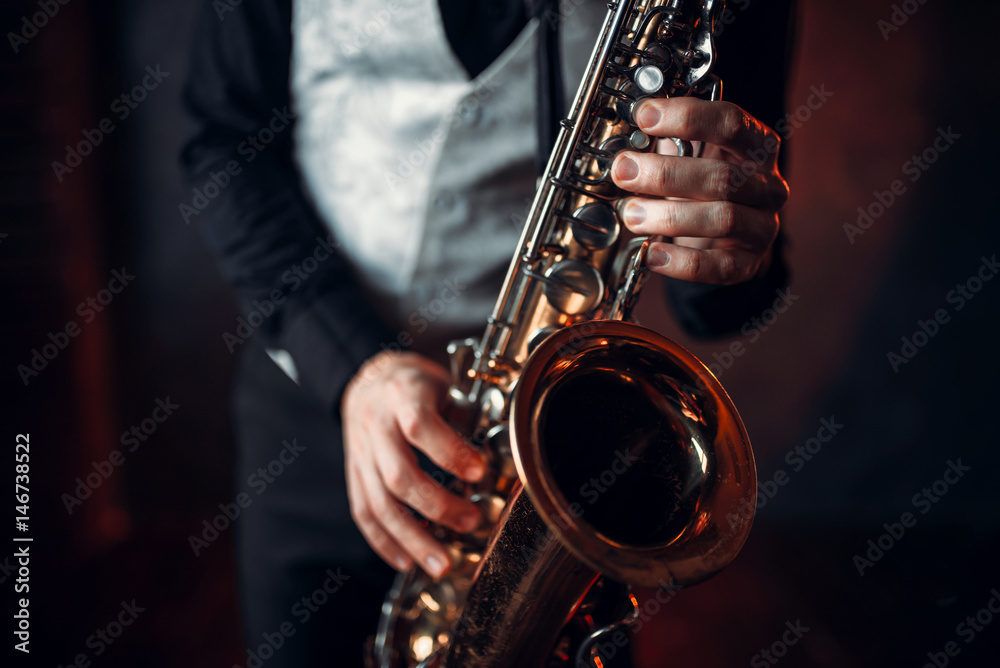 Jazz man hands holding saxophone closeup - obrazy, fototapety, plakaty 