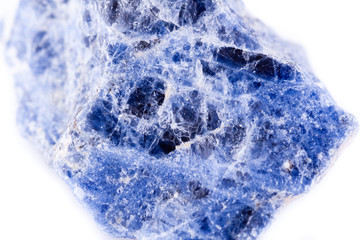 macro mineral sodalite stone on a white background