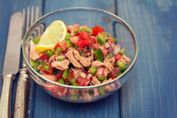 Wall Mural - tuna salad with tomato and pepper in bowl