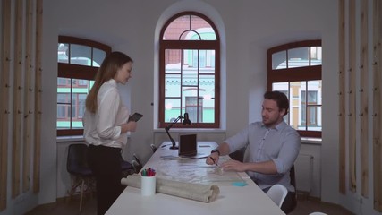Aufkleber - Architect working with plan in the office. Middle aged man greeting client. Attractive woman come in the room with happy smile. Appointment with designer.