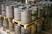 Beer Kegs. Many Metal Beer Keg Stand In Rows In A Warehouse