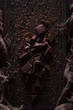 Bitter dark chocolate on a dark wooden background.
