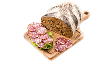 Sticker - Bread and a sandwich with salami close-up