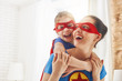 Girl and mom in Superhero costumes