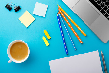 Poster - Start of Morning work office desk with a cup of coffee computer laptop pencil Sheet paper notebook pen blue texture table Business concept background
