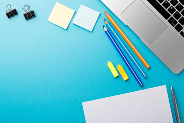 Poster - Start of Morning work office desk with computer laptop pencil Sheet paper notebook pen blue texture table Business concept background
