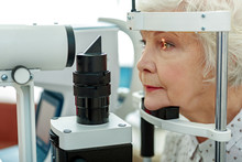 Sight Of Old Woman Verifying By Apparatus