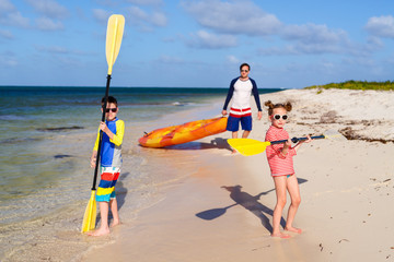 Wall Mural - Family kayaking at tropical ocean