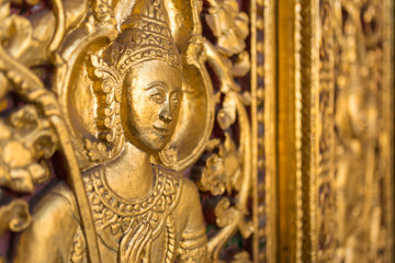 Wall Mural - Beautiful golden carving on the door of Wat Sensoukharam temple in Luang Prabang, Laos