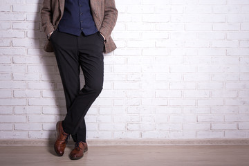 close up of male legs in business suit and shoes