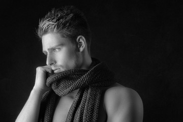 Portrait of a fashionable handsome man model with scarf - black and white