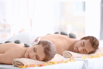 Poster - Young happy couple relaxing in spa salon