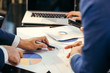 © vacancylizm - Business man working at office with laptop and documents,businessmen using documents at meeting,Teamwork Togetherness Unity Variation Support Concept,Business team analyzing financial documents.