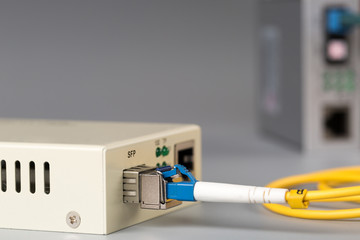 Two media converters connected by fiber cable