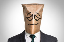 Businessman With A Bag On The Head - With Sad Face