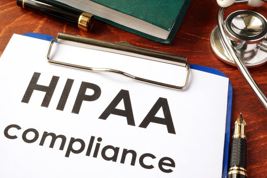 HIPAA compliance form on a clipboard. Medical privacy concept.