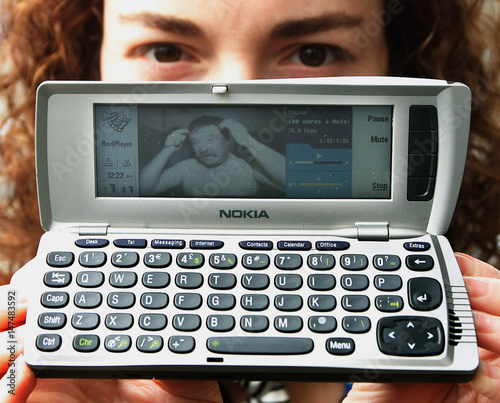 A Model Displays The New Nokia 9210i Communicator At Cebit In