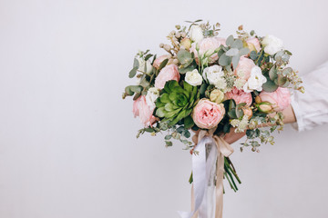 Beautiful bouquet in the hands of a florist