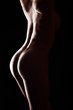 © Connect Images - Naked woman standing in dark