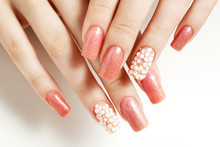 Pink nails. Female manicure and floral patterns.