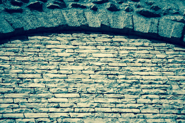 Wall Mural - Brick wall with arch frame. Toned photo.