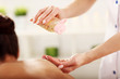 © Kalim - Beautiful woman getting massage in spa