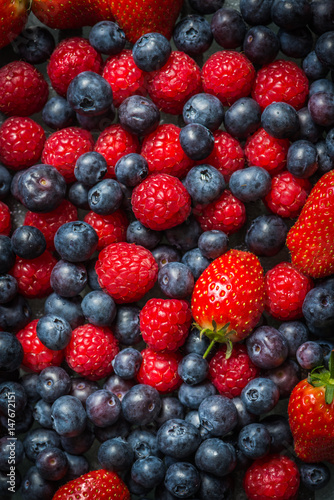 Obraz w ramie Variety of Fresh Berries such as Blueberries, Raspberries and Strawberries