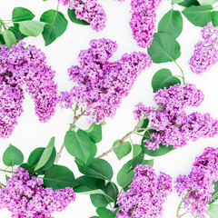  Floral pattern of lilac branches and leaves on pink background. Flat lay, top view. Flower pattern