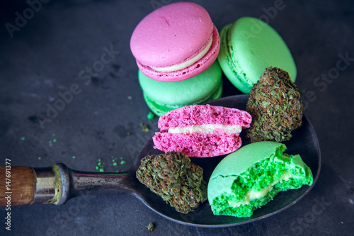 Fotografie, Obraz Eating Marijuana Edibles On Vintage Spoon With Cannabis Nugs On Dark Slate Background
