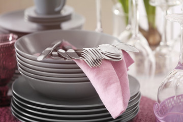 Wall Mural - Set of dishware and cutlery with lilac napkin, closeup