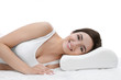 © Africa Studio - Young woman lying on bed with orthopedic pillow against white background. Healthy posture concept