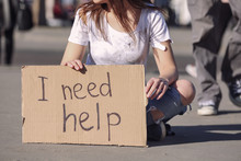 Poor Woman Begging For Help On The Street
