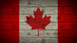 Flag of Canada painted on old wood boards