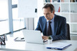 © LIGHTFIELD STUDIOS - businessman working in office