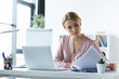 © LIGHTFIELD STUDIOS - serious businesswoman working with documents