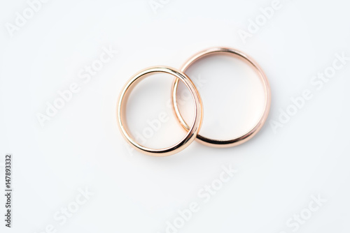Fotografie, Obraz two golden wedding rings isolated on white, wedding rings background concept