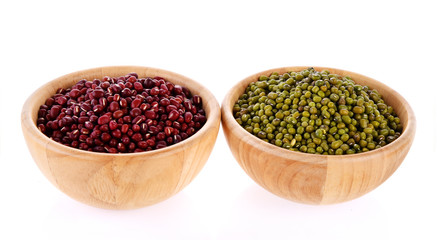 Wall Mural - green beans and  red beans, wooden bowls on white background