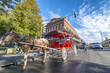 NEW ORLEANS, USA - FEBRUARY 2016: Red horse carriage along Jackson Square. New Orleans attracts 10 million tourists annually