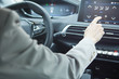 © ZoomTeam - Car dashboard. Radio closeup. Woman sets up air conditioning