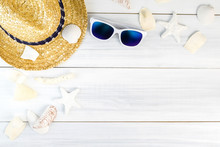 Summer Beach Accessories (White Sunglasses,starfish,straw Hat,shell) On White Plaster Wood Table Top View,Summer Vacation Concept,Leave Space For Adding Text