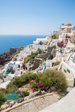 Fototapeta Natura - View of Fira town - Santorini island,Crete,Greece. White concrete staircases leading down to beautiful bay with clear blue sky and sea